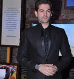 Neil launches coffee table book