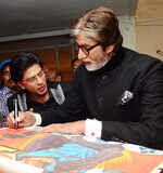 Big B signs autograph for SRK